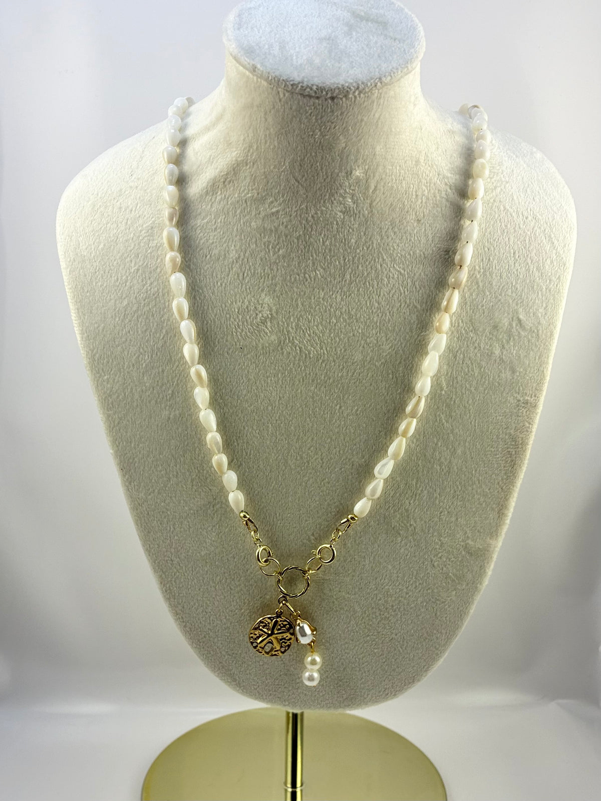 Handcrafted Mother of Pearl Rice Bead Necklace with Gold Sand Dollar Pendant