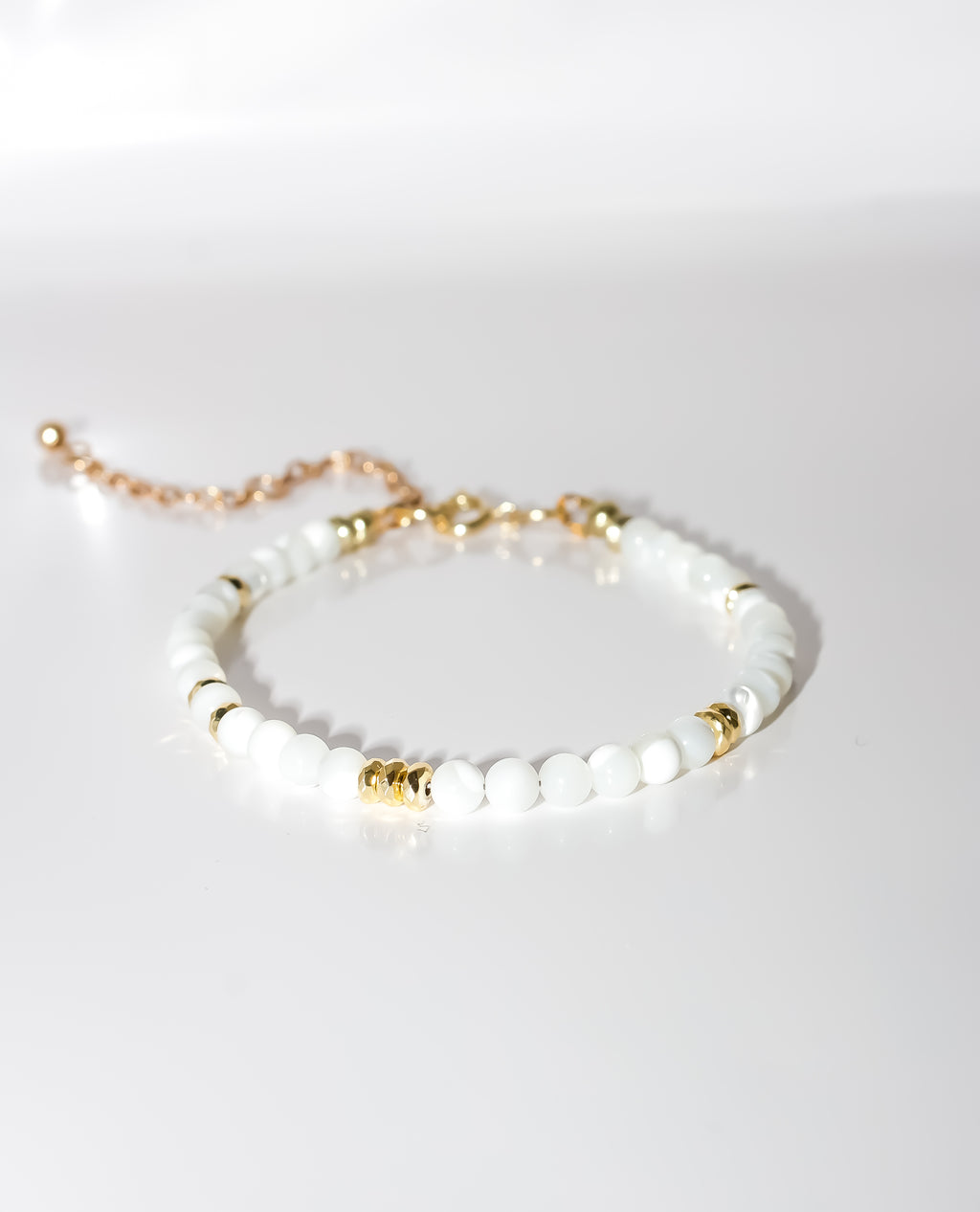 White Beaded Bracelet with Gold Accents