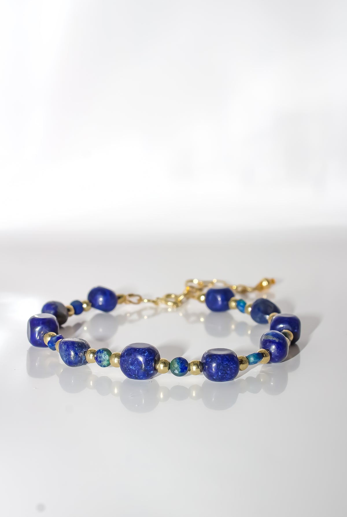 Lapis Lazuli Beaded Bracelet with Emerald Accents and Gold Spacers