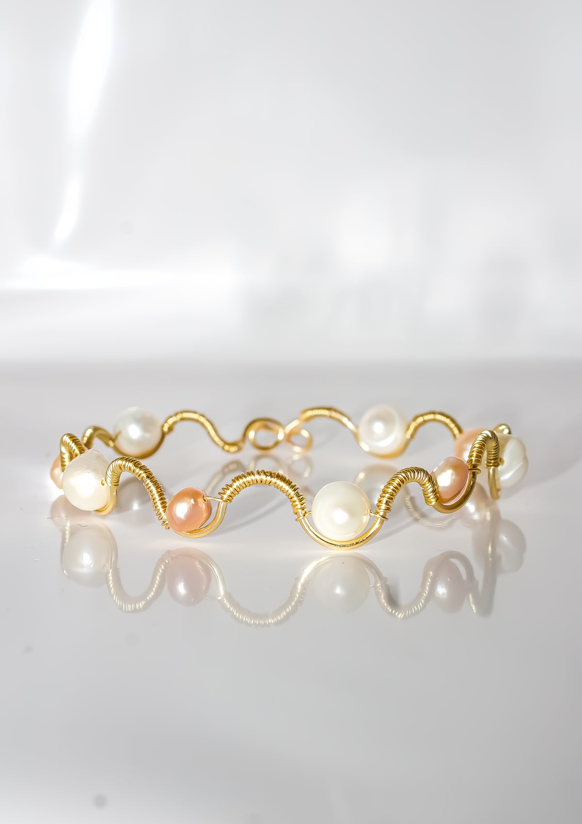 Gold Wire-Wrapped Wave Bracelet with Cream and Peach Pearls